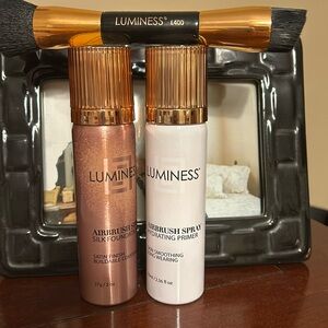 Spray on luminess primer and foundation in light medium.  With brush.